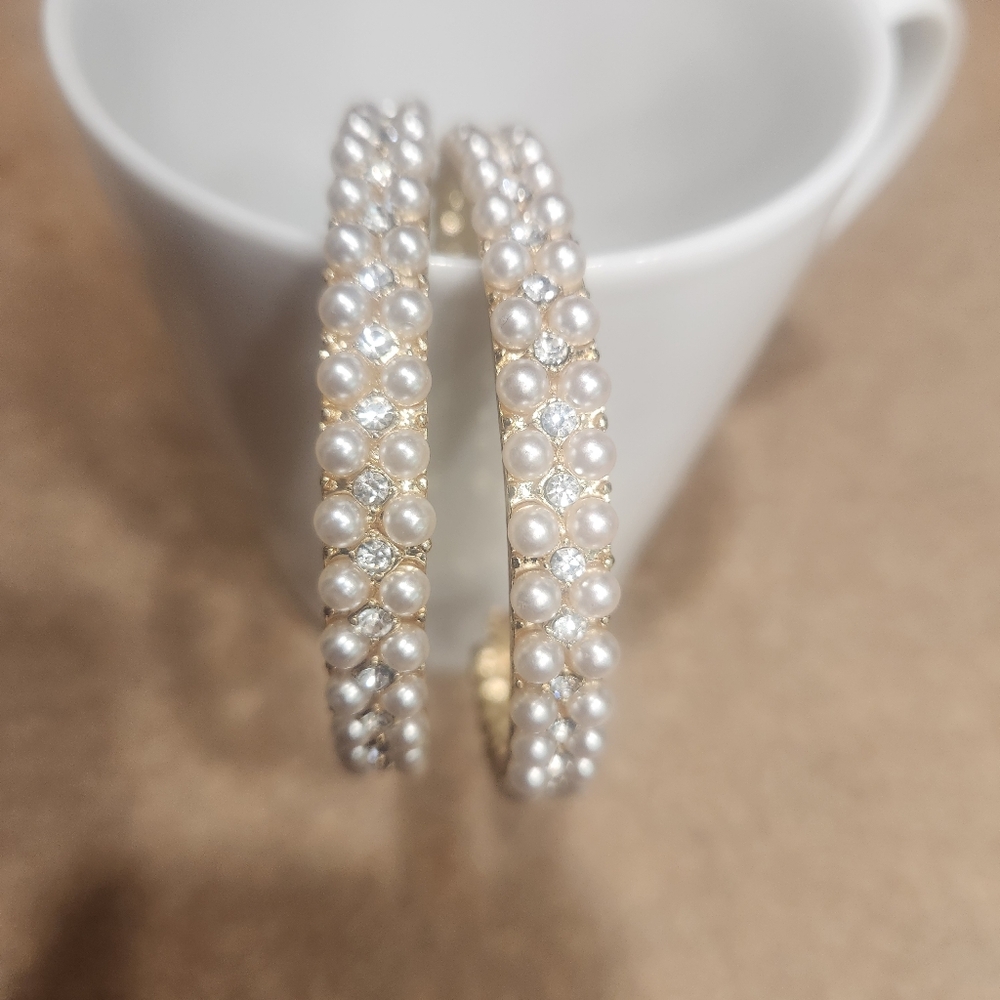 Pearl hoops, gold on the inside.